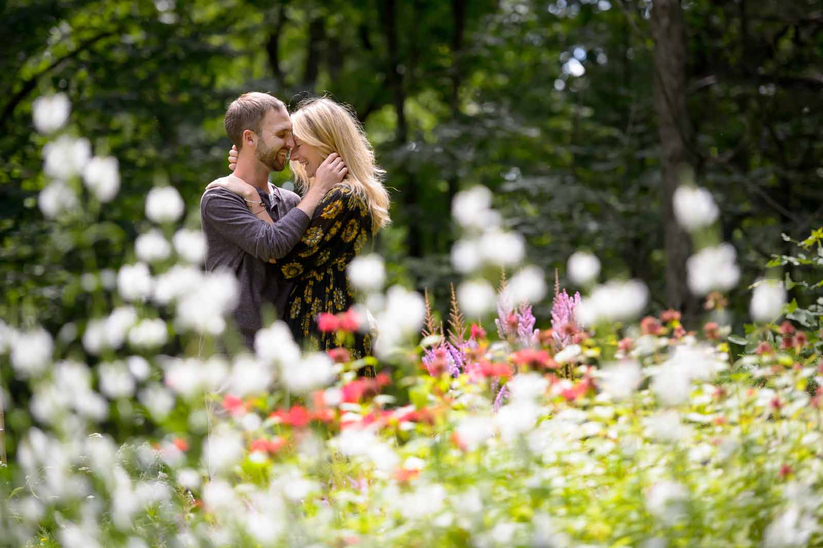A romantic embrace with an engaged couple at Mackenzie King Estates in Gatineau
