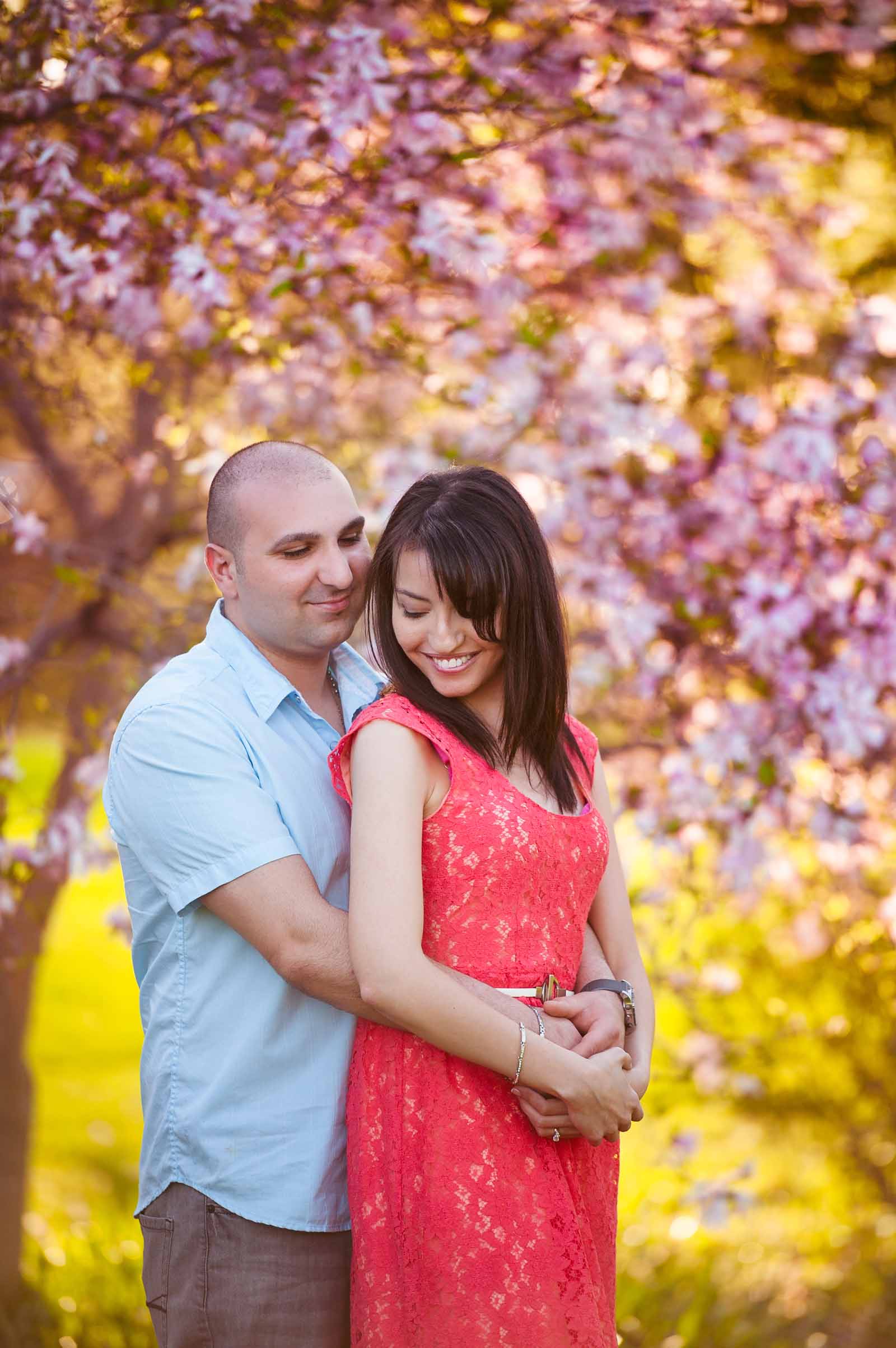 A silhouetted image of a couple walking at their engagement session at the Arboretum in Ottawa