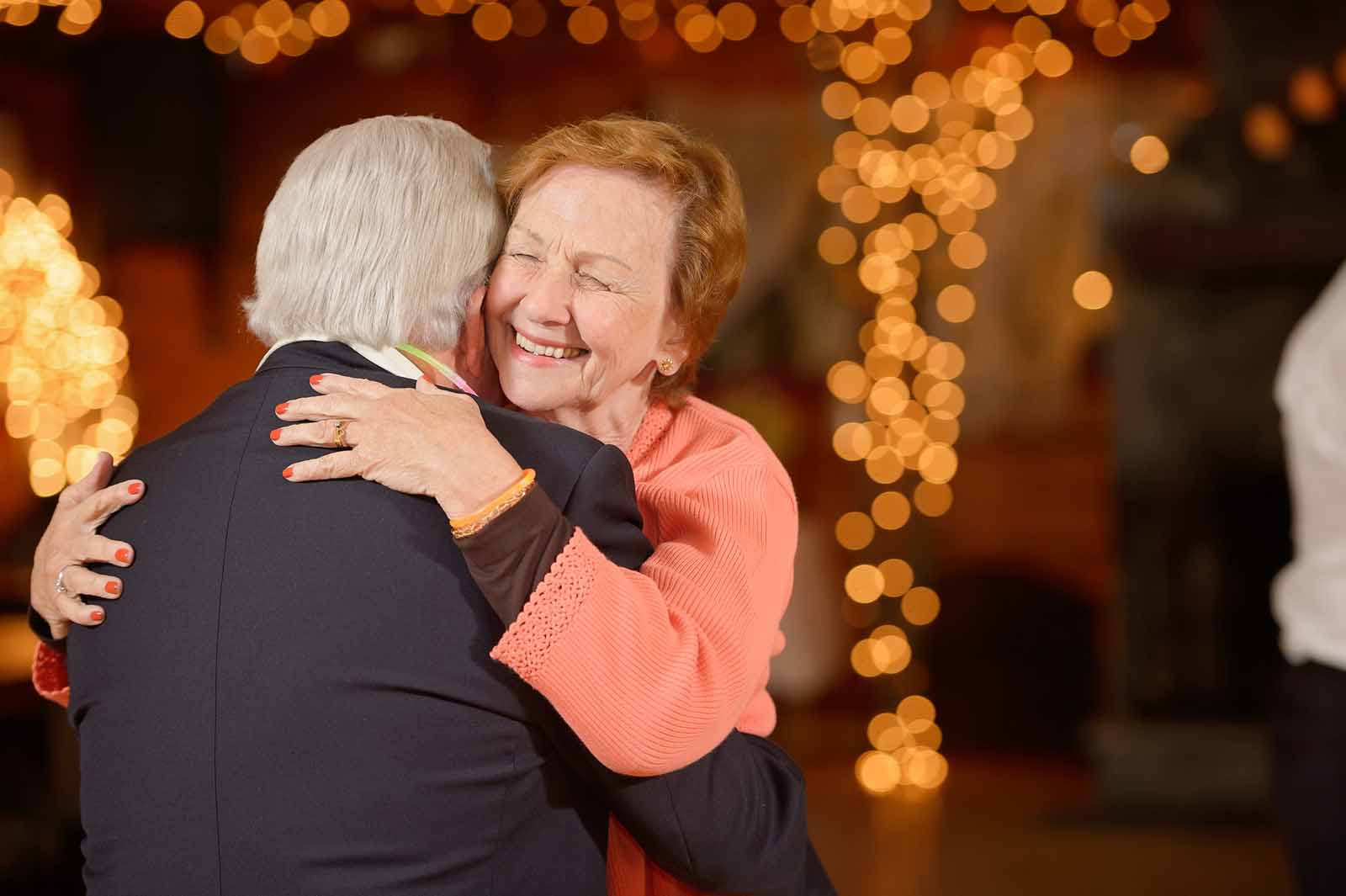 Grandparents dancing at the wedding reception of their daughter