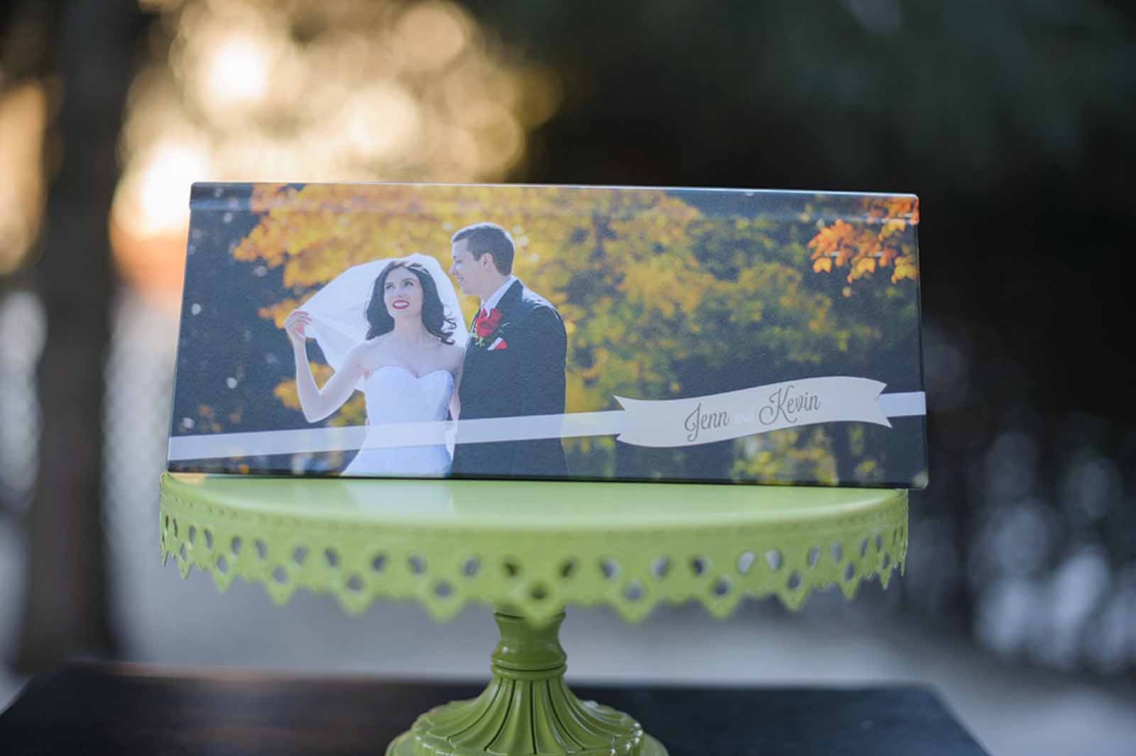 PanoVista wedding album displayed on a green cake stand